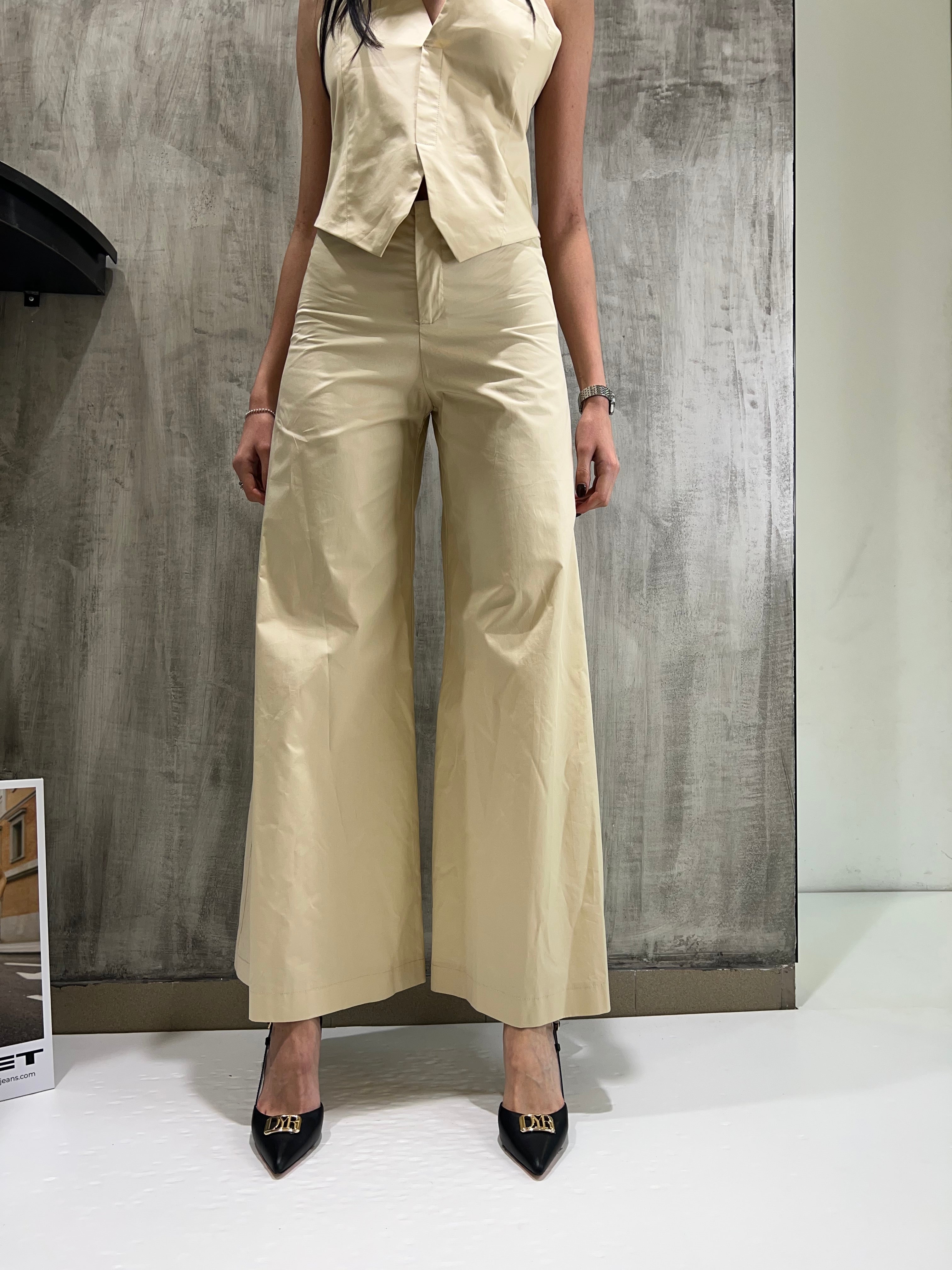 Pantaloni crema a zampa