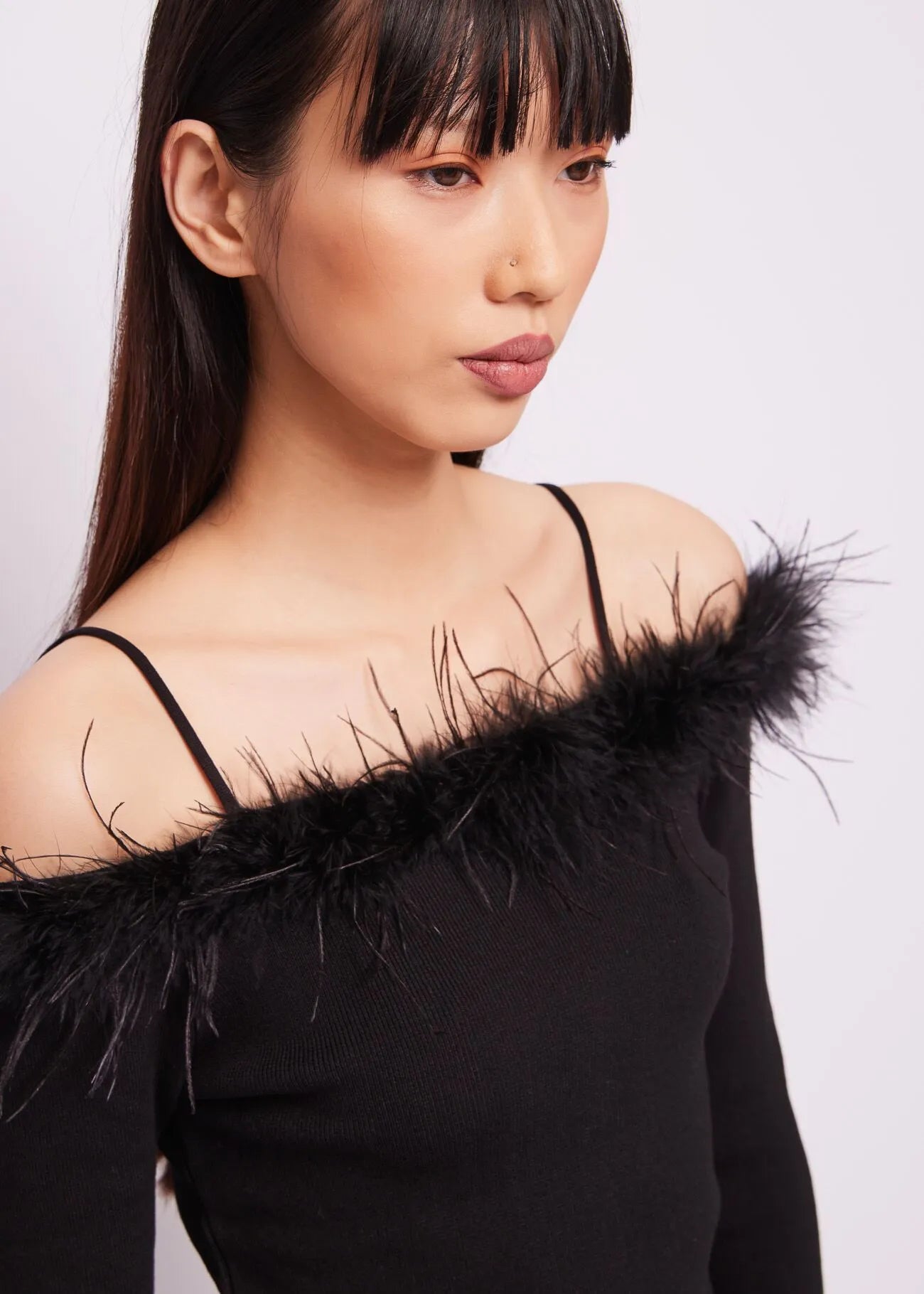 MAGLIA CON PIUME
