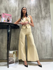 Pantaloni crema a zampa
