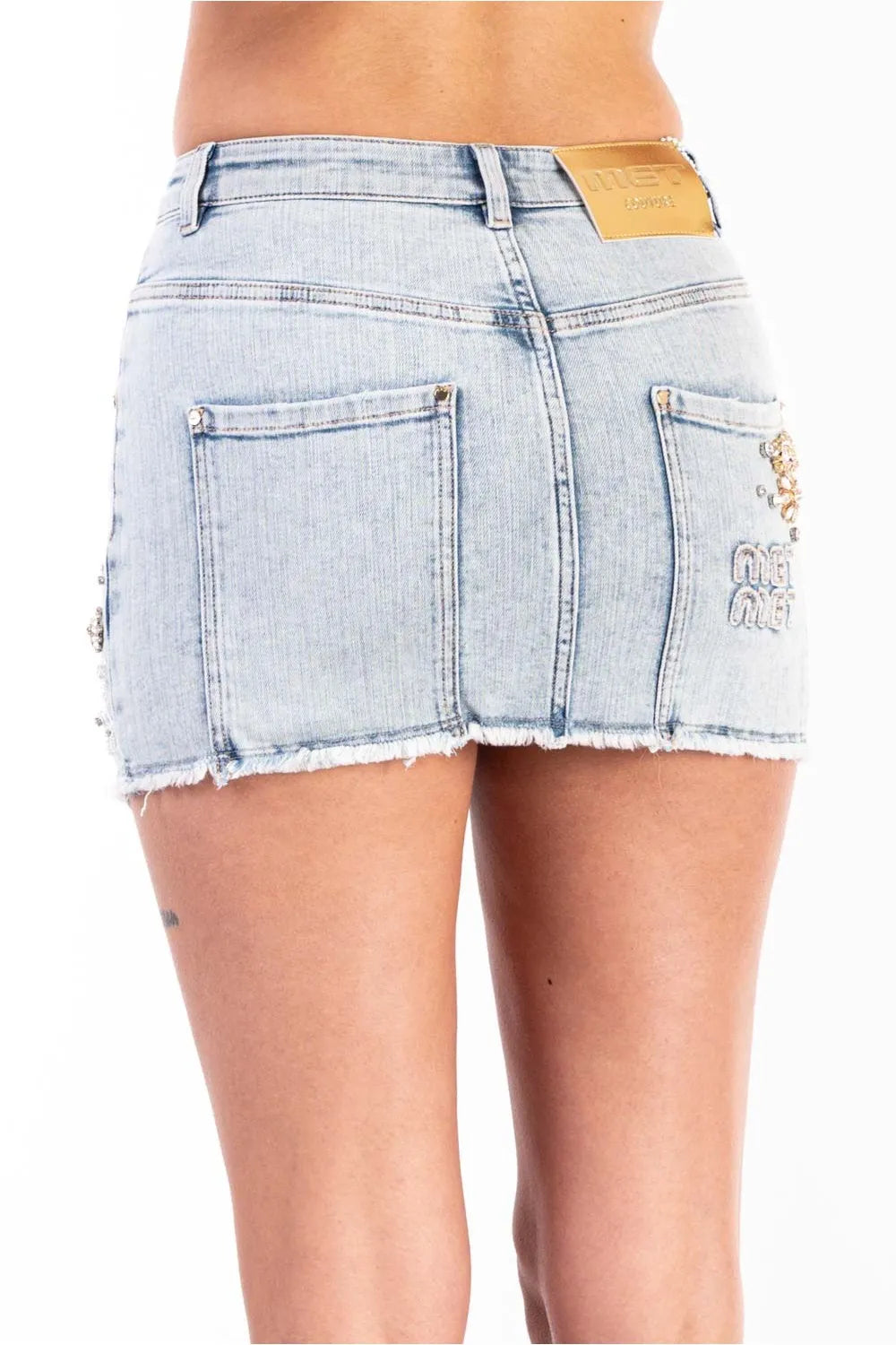 Gonna denim con applicazioni