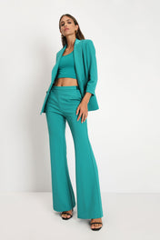 Pantaloni flare monocolour con piega stirata
