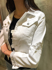 Giubbino in jeans con strass e rotture