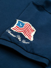 Polo in piquet con patch bluette