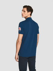 Polo in piquet con patch bluette